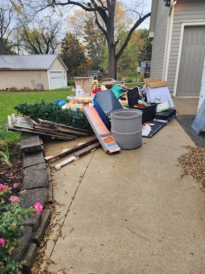 Dumpster being loaded with debris for 3 Yard Dumpster Rental in CaÃÂ±on City